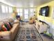 Bright living room with comfy seating and nautical decor at 6501 Center Ln, North Port, FL 34287