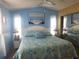 Spacious main bedroom with a king-size bed and ensuite bathroom at 6501 Center Ln, North Port, FL 34287