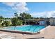 Community swimming pool with people swimming at 6501 Center Ln, North Port, FL 34287