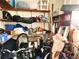 Small cluttered storage room with shelves and various items at 6501 Center Ln, North Port, FL 34287