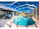 Screened-in pool with outdoor seating, offering a relaxing backyard oasis at 1052 Eppinger Dr, Port Charlotte, FL 33953