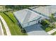 Aerial view of single-Gathering home with gray roof and driveway at 12717 Morning Mist Pl, Venice, FL 34293