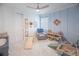 bedroom with sitting area, toy storage, and play area at 12717 Morning Mist Pl, Venice, FL 34293