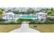 Resort-style pool with cabanas and lush landscaping at 12717 Morning Mist Pl, Venice, FL 34293