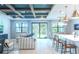 Open living space with high ceilings, exposed beams, and large windows at 12717 Morning Mist Pl, Venice, FL 34293