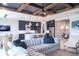 Open concept living room with a sectional sofa and kitchen view at 12717 Morning Mist Pl, Venice, FL 34293