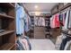 Spacious walk-in closet with custom built-ins and ample storage at 12717 Morning Mist Pl, Venice, FL 34293