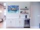 Built-in wet bar with wine cooler and quartz countertop at 12717 Morning Mist Pl, Venice, FL 34293