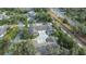 Aerial view of a well-maintained residential community with mature trees and neatly arranged homes at 1407 Red Oak Ln, Port Charlotte, FL 33948