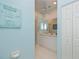 Bathroom featuring dual sinks, white cabinetry, and a tiled floor at 1407 Red Oak Ln, Port Charlotte, FL 33948