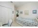 Cozy bedroom with white floors, closet, twin bed and nautical decor at 1407 Red Oak Ln, Port Charlotte, FL 33948