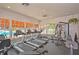 Well-equipped gym with treadmills, weight machines, and plenty of natural light at 1407 Red Oak Ln, Port Charlotte, FL 33948