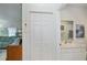 View of hallway featuring a closet that is next to a bathroom and a living area at 1407 Red Oak Ln, Port Charlotte, FL 33948
