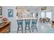 Kitchen island with seating and a bright view into a breakfast nook at 1407 Red Oak Ln, Port Charlotte, FL 33948