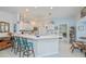 Kitchen island with seating and a view into the bedroom at 1407 Red Oak Ln, Port Charlotte, FL 33948