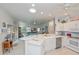 Airy kitchen with an open concept design and seamless transition to the living room at 1407 Red Oak Ln, Port Charlotte, FL 33948
