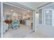 View from sunroom to living room featuring open floor plan and kitchen at 1407 Red Oak Ln, Port Charlotte, FL 33948
