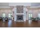 Well-lit meeting space features a stone fireplace, built-in shelving, and comfortable seating at 1407 Red Oak Ln, Port Charlotte, FL 33948