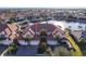 Aerial view of waterfront property showing a luxurious home with private garages and a canal view at 141 Tropicana Dr # 1111, Punta Gorda, FL 33950