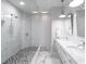 Modern bathroom with double vanity, walk-in shower, and marble tile at 141 Tropicana Dr # 1111, Punta Gorda, FL 33950