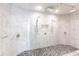 Large bathroom with a walk-in shower, marble tile, and double shower heads at 141 Tropicana Dr # 1111, Punta Gorda, FL 33950