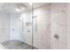 Large bathroom with a walk-in shower, marble tile, and double shower heads at 141 Tropicana Dr # 1111, Punta Gorda, FL 33950
