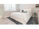 Spacious bedroom with a king-size bed, window seating and coastal decor at 141 Tropicana Dr # 1111, Punta Gorda, FL 33950