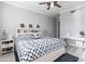 Spacious bedroom with a king-size bed, nightstands, and decorative wall art at 141 Tropicana Dr # 1111, Punta Gorda, FL 33950