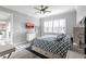 Bright bedroom with a king-size bed, window seating, and a TV at 141 Tropicana Dr # 1111, Punta Gorda, FL 33950