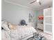 Serene bedroom with a full-size bed, dresser, and coastal-inspired art at 141 Tropicana Dr # 1111, Punta Gorda, FL 33950