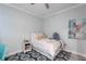 Cozy bedroom with a full-size bed, decorative rug, and ocean-themed decor at 141 Tropicana Dr # 1111, Punta Gorda, FL 33950