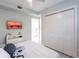 Bedroom with large closet and mounted TV at 141 Tropicana Dr # 1111, Punta Gorda, FL 33950