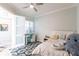 Light bedroom with a full-size bed, built-in desk and ocean-themed decor at 141 Tropicana Dr # 1111, Punta Gorda, FL 33950