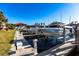 A boat is lifted on a personal boat dock at 141 Tropicana Dr # 1111, Punta Gorda, FL 33950