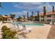 Relaxing community pool with lounge chairs at 141 Tropicana Dr # 1111, Punta Gorda, FL 33950