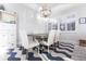 Bright dining room with a grey table and white chairs at 141 Tropicana Dr # 1111, Punta Gorda, FL 33950