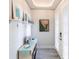 Bright entryway with white shiplap walls, coastal decor, and double French doors at 141 Tropicana Dr # 1111, Punta Gorda, FL 33950