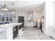 Modern kitchen featuring stainless steel appliances and white cabinetry at 141 Tropicana Dr # 1111, Punta Gorda, FL 33950