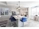 Bright white kitchen with stainless steel appliances and marble island at 141 Tropicana Dr # 1111, Punta Gorda, FL 33950