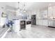 Spacious kitchen with island, stainless steel appliances, and white cabinets at 141 Tropicana Dr # 1111, Punta Gorda, FL 33950