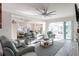 Open-concept living room with comfortable seating, a fireplace, and views of the kitchen at 141 Tropicana Dr # 1111, Punta Gorda, FL 33950