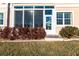 White sunroom with glass windows and door at 141 Tropicana Dr # 1111, Punta Gorda, FL 33950