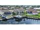 Aerial view showcasing house, pool, boat dock, and canal at 1412 Sea Fan Dr, Punta Gorda, FL 33950