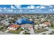 Bird's-eye view of waterfront home in a community with many canals and boats at 1412 Sea Fan Dr, Punta Gorda, FL 33950