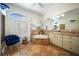 Large bathroom with tile flooring, a garden tub, and double vanity at 1412 Sea Fan Dr, Punta Gorda, FL 33950