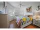 Cozy bedroom with a full-size bed and colorful bedding at 1412 Sea Fan Dr, Punta Gorda, FL 33950