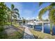 Private boat dock with pathway, perfect for enjoying waterfront living at 1412 Sea Fan Dr, Punta Gorda, FL 33950