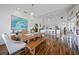 Bright dining room with a large wooden table and kitchen views at 1412 Sea Fan Dr, Punta Gorda, FL 33950