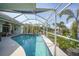 Inviting pool area with screened enclosure, offering a relaxing outdoor space at 1412 Sea Fan Dr, Punta Gorda, FL 33950