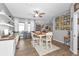 Bright dining area with built-in workspace and hardwood floors at 1418 Purple Ln, North Port, FL 34286